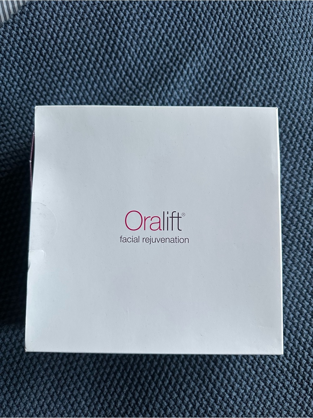 Oralift Facial Rejuvenation Device - White with Pink Logo